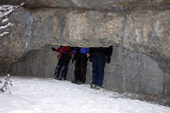 08 Peter Ryan, Jerome Ryan and Charlotte Ryan With Heads in Cave At Banff Grotto Canyon In Winter.jpg